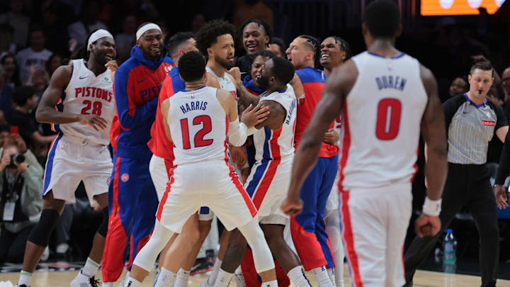 Mar 19, 2025; Miami, Florida, USA; Detroit Pistons guard Cade Cunningham (2) celebrates with forward Tim Hardaway Jr. (8), forward Tobias Harris (12) and other teammates after scoring the game-winning basket against the Miami Heat during the fourth quarter at Kaseya Center. Mandatory Credit: Sam Navarro-Imagn Images