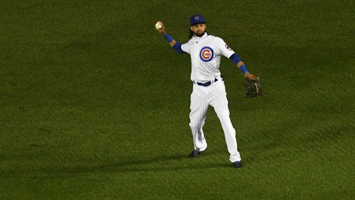 Sep 8, 2020; Chicago, Illinois, USA; Chicago Cubs center fielder Billy Hamilton (6) throws the ball after Cincinnati Reds left fielder Brian Goodwin (17) singles in the ninth inning at Wrigley Field. Mandatory Credit: Matt Marton-Imagn Images
