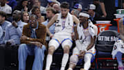 Nov 12, 2025; Oklahoma City, Oklahoma, USA; Oklahoma City Thunder guard Jalen Williams (8), center Chet Holmgren (7), and guard Shai Gilgeous-Alexander (2) talk while sitting on the bench during the fourth quarter against the Los Angeles Lakers at Paycom Center. Mandatory Credit: Alonzo Adams-Imagn Images