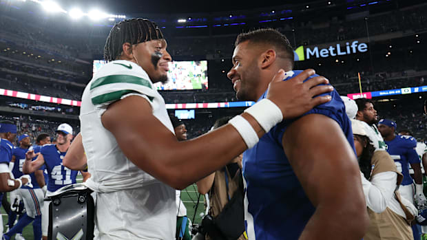 New York Jets quarterback Justin Fields and New York Giants quarterback Russell Wilson