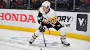 Oct 14, 2025; Anaheim, California, USA; Pittsburgh Penguins center Sidney Crosby (87) controls the puck against the Anaheim Ducks during the third period at Honda Center. Mandatory Credit: Gary A. Vasquez-Imagn Images