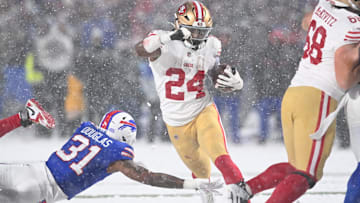 San Francisco 49ers running back Jordan Mason (24) avoids a tackle by Buffalo Bills cornerback Rasul Douglas (31)