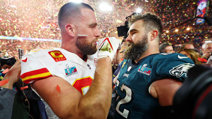 Feb 12, 2023; Glendale, Arizona, US; Kansas City Chiefs tight end Travis Kelce (87) talks with his brother Philadelphia Eagles center Jason Kelce (62) after he won Super Bowl LVII at State Farm Stadium.