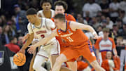 Mar 30, 2024; Los Angeles, CA, USA; Alabama Crimson Tide guard Rylan Griffen (3) controls the ball against Clemson Tigers guard Joseph Girard III (11) in the second half in the finals of the West Regional of the 2024 NCAA Tournament at Crypto.com Arena. Mandatory Credit: Jayne Kamin-Oncea-Imagn Images
