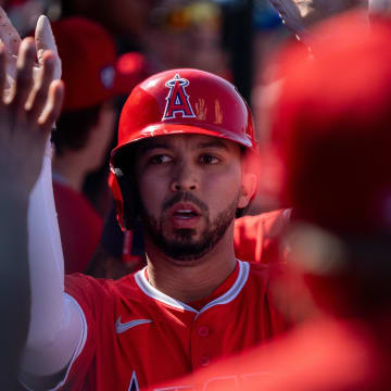 Mar 10, 2024; Tempe, Arizona, USA; Los Angeles Angels infielder Livan Soto (73) celebrates with his team after scoring in the sixth during a spring training game against the San Diego Padres at Tempe Diablo Stadium. Mandatory Credit: Allan Henry-USA TODAY Sports