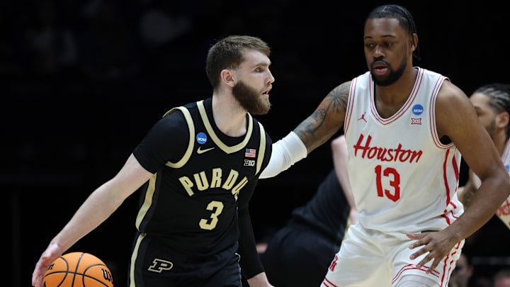 Mar 28, 2025; Indianapolis, IN, USA; Purdue Boilermakers guard Braden Smith (3) dribbles the ball agaistn Houston Cougars forward J'Wan Roberts (13) in the first half during a Midwest Regional semifinal of the 2025 NCAA tournament at Lucas Oil Stadium. Mandatory Credit: Trevor Ruszkowski-Imagn Images