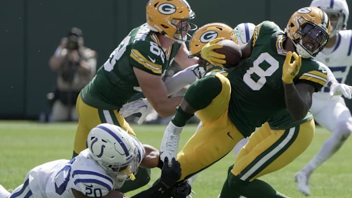 Sep 15, 2024; Green Bay, Wisconsin, USA;  Indianapolis Colts safety Nick Cross (20) makes a tackle on Green Bay Packers running back Josh Jacobs (8) during the first quarter at Lambeau Field. 
