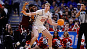 Mar 20, 2025; Denver, CO, USA; Montana Grizzlies forward Te'Jon Sawyer (32) defends against Wisconsin Badgers forward Steven Crowl (22) during the second half in the first round of the NCAA Tournament at Ball Arena. 