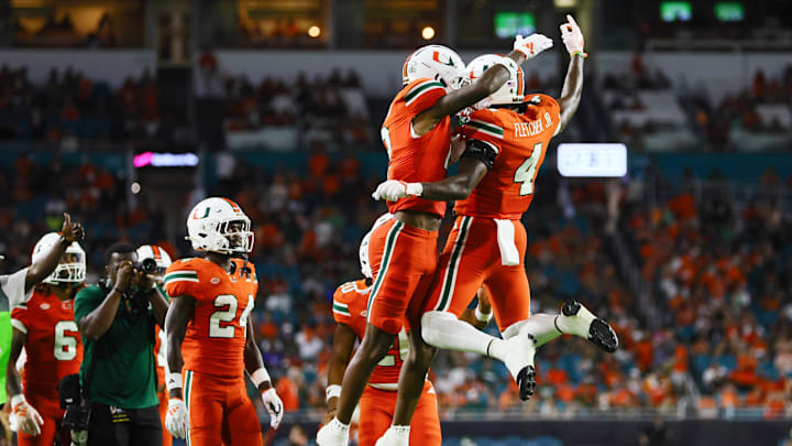 Sep 7, 2024; Miami Gardens, Florida, USA; Miami Hurricanes running back Mark Fletcher Jr. (4) celebrates with running back Jordan Lyle (21) after scoring against the Florida A&M Rattlers during the third quarter at Hard Rock Stadium. Mandatory Credit: Sam Navarro-Imagn Images