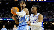 Apr 2, 2022; New Orleans, LA, USA; North Carolina Tar Heels guard Caleb Love (2) handles the ball against Duke Blue Devils guard Trevor Keels (1) during the second half in the 2022 NCAA men's basketball tournament Final Four semifinals at Caesars Superdome. 