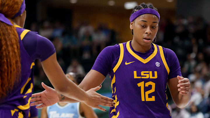 Nov 17, 2025; New Orleans, Louisiana, USA; LSU Tigers guard Mikaylah Williams (12) reacts after a free throw with LSU Tigers guard Zakiyah Johnson (11) against the Tulane Green Wave during the second half at Avron B. Fogelman Arena in Devlin Fieldhouse. Mandatory Credit: Matthew Hinton-Imagn Images