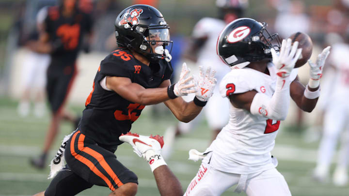 Glenville intercepts a pass intended for Massillon in the first half at Paul Brown Tiger Stadium. Friday, August 22, 2025. Glenville intercepts a pass intended for Massillon in the first half at Paul Brown Tiger Stadium. Friday, August 22, 2025.