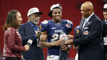 Dec 16, 2017; Atlanta, GA, USA; North Carolina A&T Aggies defensive back Franklin Mac McCain III (29) holds the defensive most valuable player trophy after a victory against the Grambling State Tigers in the 2017 Celebration Bowl at Mercedes-Benz Stadium. Mandatory Credit: Brett Davis-USA TODAY Sports