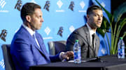 Feb 1, 2024; Charlotte, NC, USA; Carolina Panthers general manager Dan Morgan (left) speaks with new coach Dave Canales during the introductory press conference at Bank of America Stadium. Mandatory Credit: Jim Dedmon-Imagn Images