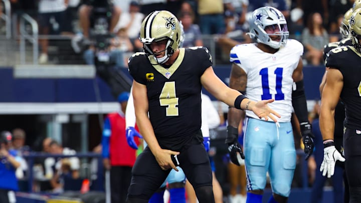 Sep 15, 2024; Arlington, Texas, USA; New Orleans Saints quarterback Derek Carr (4) celebrates after scoring a touchdown  during the first half against the Dallas Cowboys at AT&T Stadium. Mandatory Credit: Kevin Jairaj-Imagn Images