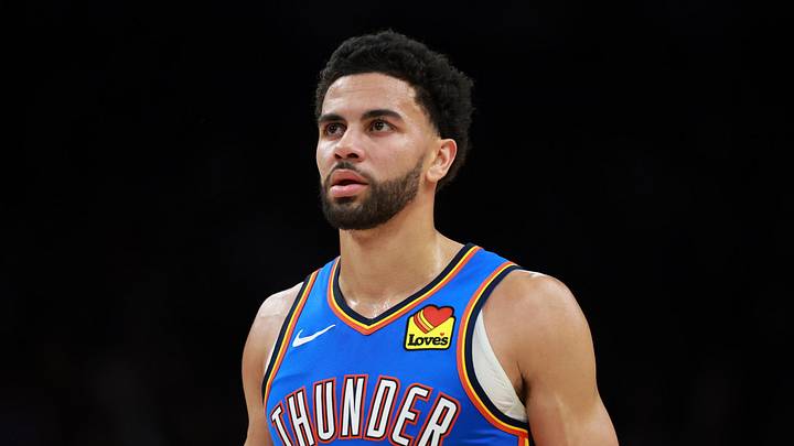 Jan 4, 2026; Phoenix, Arizona, USA; Oklahoma City Thunder guard Ajay Mitchell (25) against the Phoenix Suns at Mortgage Matchup Center. Mandatory Credit: Mark J. Rebilas-Imagn Images