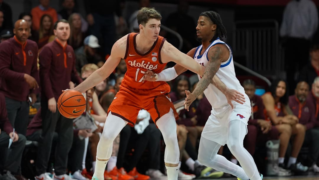 Jan 14, 2026; Dallas, Texas, USA;  Virginia Tech Hokies guard Neoklis Avdalas (17) works on SMU Mustangs guard B.J. Edwards (0) during the second half at Moody Coliseum. Mandatory Credit: Raymond Carlin III-Imagn Images