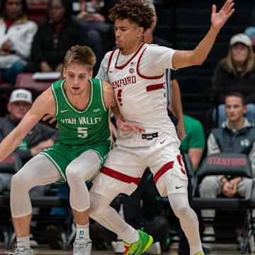 Utah Valley Wolverines guard Tanner Toolson (5) is guarded by Stanford Cardinal guard Oziyah Sellers (4) during the first quarter at Maples Pavilion