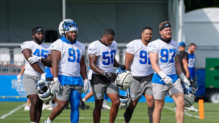 Defensive Lineman Issac Ukwu, Levi Onwuzurike, LB Mitchell Agude, Marcus Davenport and Aidan Hutchinson walk off the field during day two of the Detroit Lions training camp at the Detroit Lions Headquarters in Dearborn, Mich. on Thursday, July 25, 2024.
