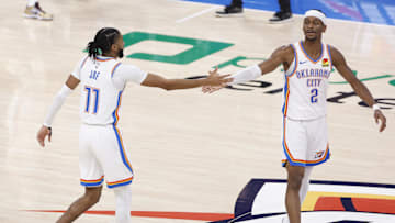 Feb 5, 2025; Oklahoma City, Oklahoma, USA; Oklahoma City Thunder guard Shai Gilgeous-Alexander (2) and guard Isaiah Joe (11) high-five after a first-half play against the Phoenix Suns at Paycom Center. Mandatory Credit: Alonzo Adams-Imagn Images