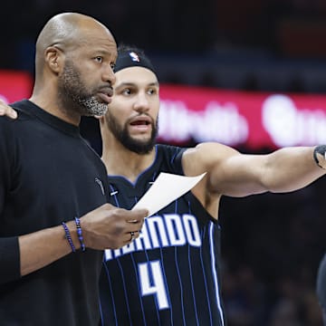 Jan 13, 2024; Oklahoma City, Oklahoma, USA; Orlando Magic guard Jalen Suggs (4) talks to head coach Jamahl Mosley during the second quarter at Paycom Center. Mandatory Credit: Alonzo Adams-Imagn Images