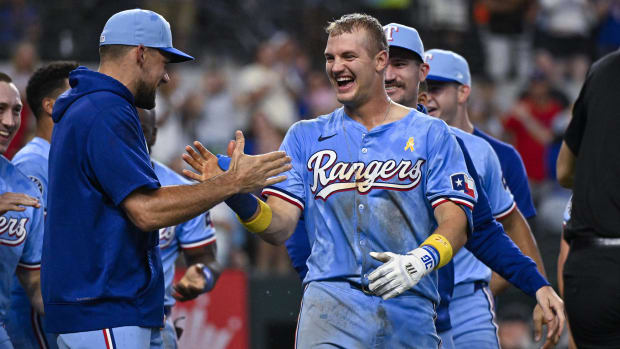 Texas Rangers slugger Josh Jung celebrates his walk-off home run over the Oakland Athletics.