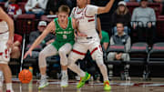 Dec 3, 2024; Stanford, California, USA; Utah Valley Wolverines guard Tanner Toolson (5) is guarded by Stanford Cardinal guard Oziyah Sellers (4) during the first quarter at Maples Pavilion. Mandatory Credit: Neville E. Guard-Imagn Images