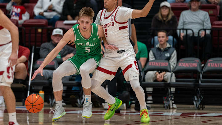 Dec 3, 2024; Stanford, California, USA; Utah Valley Wolverines guard Tanner Toolson (5) is guarded by Stanford Cardinal guard Oziyah Sellers (4) during the first quarter at Maples Pavilion. Mandatory Credit: Neville E. Guard-Imagn Images Dec 3, 2024; Stanford, California, USA; Utah Valley Wolverines guard Tanner Toolson (5) is guarded by Stanford Cardinal guard Oziyah Sellers (4) during the first quarter at Maples Pavilion. Mandatory Credit: Neville E. Guard-Imagn Images