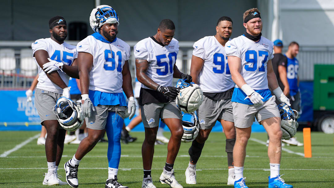 Defensive Lineman Issac Ukwu, Levi Onwuzurike, LB Mitchell Agude, Marcus Davenport and Aidan Hutchinson walk off the field during day two of the Detroit Lions training camp at the Detroit Lions Headquarters in Dearborn, Mich. on Thursday, July 25, 2024.