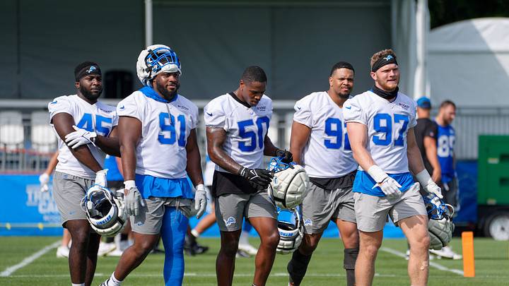 Defensive Lineman Issac Ukwu, Levi Onwuzurike, LB Mitchell Agude, Marcus Davenport and Aidan Hutchinson walk off the field during day two of the Detroit Lions training camp at the Detroit Lions Headquarters in Dearborn, Mich. on Thursday, July 25, 2024.