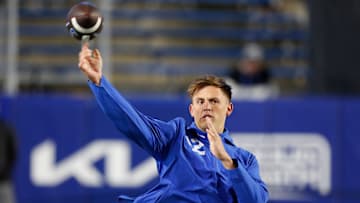 Jake Retzlaff warms up before taking on Oklahoma State.