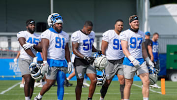Defensive Lineman Issac Ukwu, Levi Onwuzurike, LB Mitchell Agude, Marcus Davenport and Aidan Hutchinson walk off the field during day two of the Detroit Lions training camp at the Detroit Lions Headquarters in Dearborn, Mich. on Thursday, July 25, 2024.