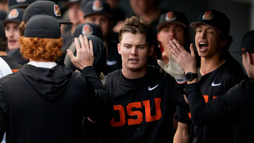 Oregon State infielder Ethan Porter celebrates with teammates after scoring as the Oregon Ducks host the Oregon State Beavers on March 3, 2026, at PK Park in Eugene, Oregon.
