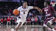 Nov 10, 2024; Athens, Georgia, USA; Georgia Bulldogs guard Silas Demary Jr. (5) dribbles against Texas Southern Tigers guard Kavion McClain (2) at Stegeman Coliseum. Mandatory Credit: Dale Zanine-Imagn Images