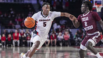 Nov 10, 2024; Athens, Georgia, USA; Georgia Bulldogs guard Silas Demary Jr. (5) dribbles against Texas Southern Tigers guard Kavion McClain (2) at Stegeman Coliseum. Mandatory Credit: Dale Zanine-Imagn Images