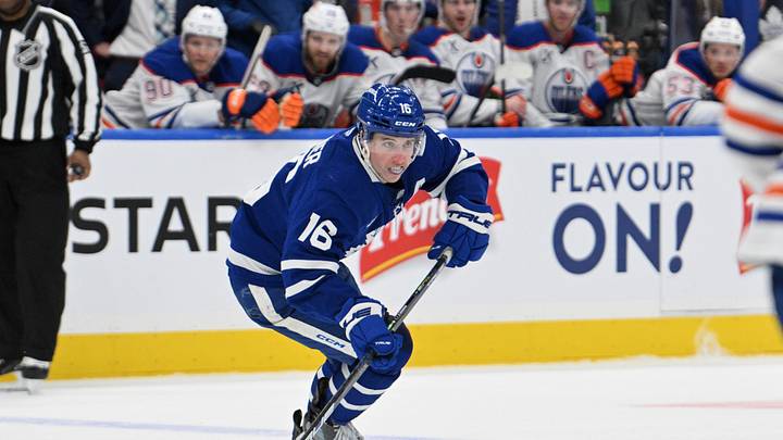 Nov 16, 2024; Toronto, Ontario, CAN; Toronto Maple Leafs forward Mitch Marner (16) skates with the puck against the Edmonton Oilers in the third period at Scotiabank Arena. Mandatory Credit: Dan Hamilton-Imagn Images