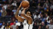 Jan 10, 2025; Denver, Colorado, USA; Brooklyn Nets center Nic Claxton (33) lines up a shot in the second half against the Denver Nuggets at Ball Arena. Mandatory Credit: Ron Chenoy-Imagn Images