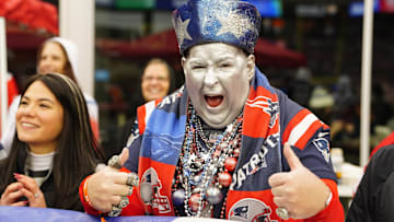  A New England Patriots fan poses for a photo during the second half of the game against the Houston Texans at Gillette Stadium.