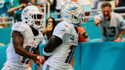 Sep 8, 2024; Miami Gardens, Florida, USA; Miami Dolphins wide receiver Tyreek Hill (10) celebrates with wide receiver Jaylen Waddle (17) after scoring a touchdown against the Jacksonville Jaguars during the third quarter at Hard Rock Stadium. Mandatory Credit: Sam Navarro-Imagn Images