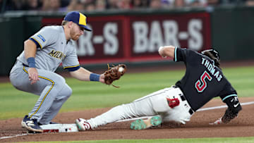 Apr 12, 2025; Phoenix, Arizona, USA; Arizona Diamondbacks outfielder Alek Thomas (5) beats the tag of Milwaukee Brewers third base Oliver Dunn (15) for a triple during the ninth inning at Chase Field. Mandatory Credit: Joe Camporeale-Imagn Images