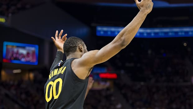 Golden State Warriors forward Jonathan Kuminga (00) reacts after hitting a three-point shot against the Toronto Raptors