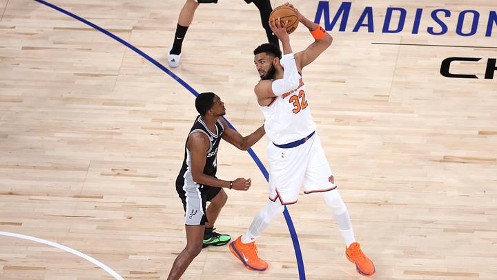 Jun 8, 2026; New York, New York, USA; New York Knicks center Karl-Anthony Towns (32) controls the ball against San Antonio Spurs guard De'aaron Fox (4) in the second quarter during game three of the 2026 NBA Finals at Madison Square Garden. Mandatory Credit: Wendell Cruz-Imagn Images
