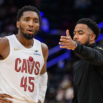 Oct 26, 2024; Washington, District of Columbia, USA; Cleveland Cavaliers guard Donovan Mitchell (45) speaks to Cleveland Cavaliers associate head coach Johnnie
Bryant during a time out in the third quarter against the Washington Wizards at Capital One Arena. Mandatory Credit: Reggie Hildred-Imagn Images