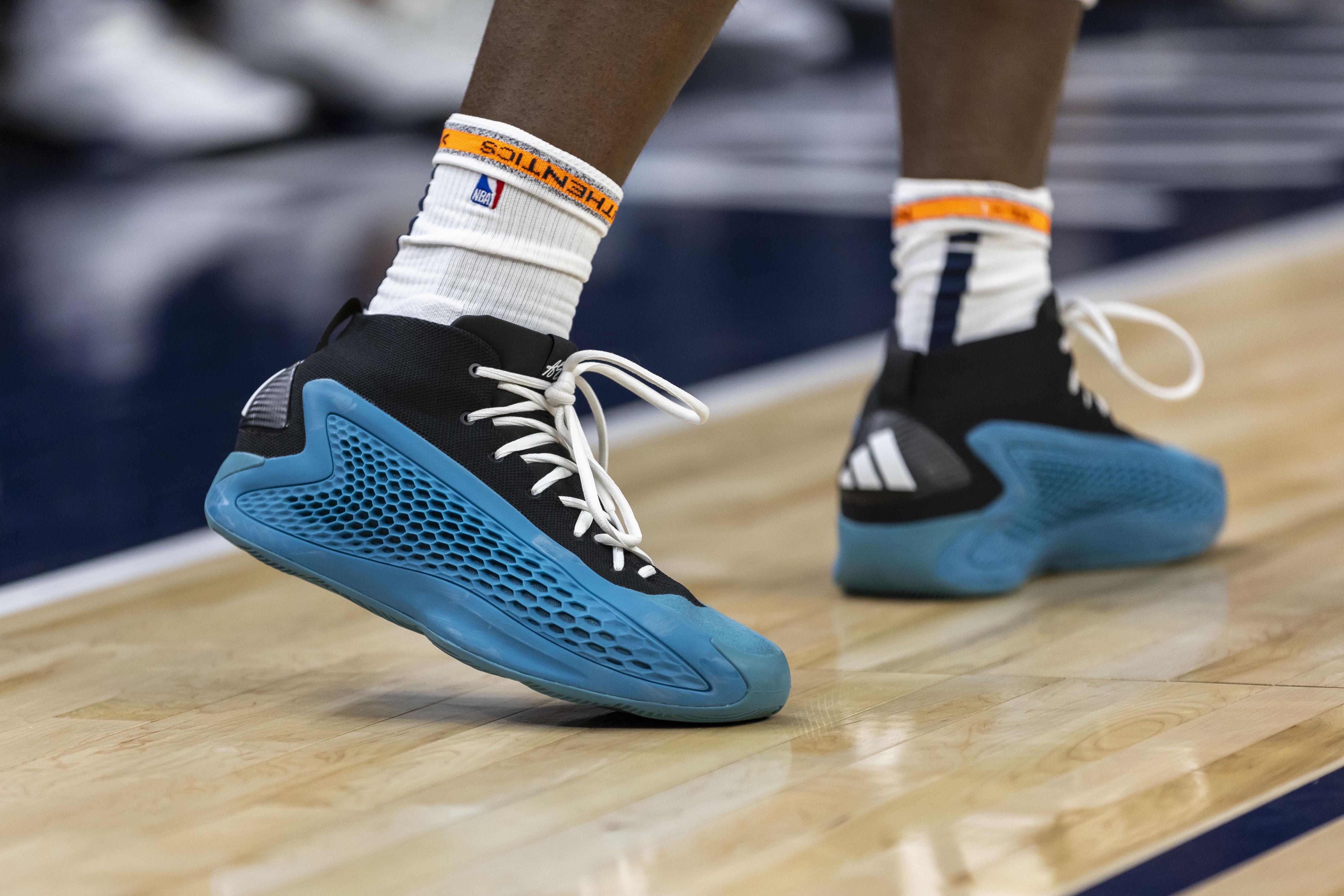 Minnesota Timberwolves guard Anthony Edwards' blue and black adidas sneakers.