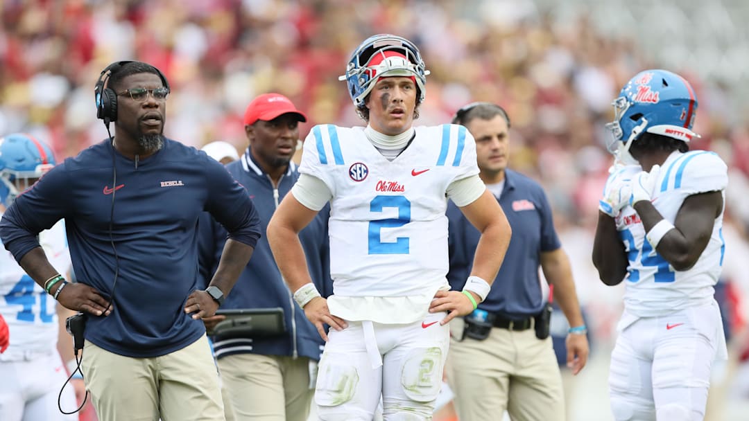 Nov 2, 2024; Fayetteville, Arkansas, USA; Ole Miss Rebels quarterback Jaxson Dart (2) looks toward an injured teammate in the second quarter against the Arkansas Razorbacks at Donald W. Reynolds Razorback Stadium. Mandatory Credit: Nelson Chenault-Imagn Images