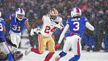 Dec 1, 2024; Orchard Park, New York, USA; San Francisco 49ers running back Jordan Mason (24) prepares for contact by Buffalo Bills safety Damar Hamlin (3) in the first quarter at Highmark Stadium. Mandatory Credit: Mark Konezny-Imagn Images