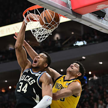 Apr 27, 2025; Milwaukee, Wisconsin, USA; Milwaukee Bucks forward Giannis Antetokounmpo (34) dunks the ball against Indiana Pacers guard Ben Sheppard (26) in the third quarter during game four of first round for the 2024 NBA Playoffs at Fiserv Forum. Mandatory Credit: Benny Sieu-Imagn Images