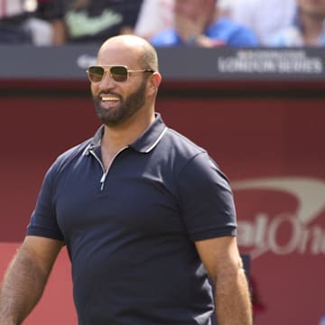Jun 25, 2023; London, GBR, ENG; St. Louis Cardinals former first baseman Albert Pujols walks on the field before throwing out a ceremonial first pitch before London series game two against the Chicago Cubs at London Stadium. Mandatory Credit: Peter van den Berg-Imagn Images