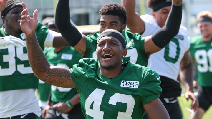 Jul 27, 2024; Florham Park, NJ; New York Jets cornerback Brandon Codrington (43) runs up the field with teammates greeting fans during training camp at Atlantic Health Jets Training Center.