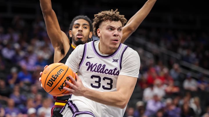 Mar 11, 2025; Kansas City, MO, USA; Kansas State Wildcats guard Coleman Hawkins (33) drives to the basket during the first half against the Arizona State Sun Devils at T-Mobile Center. Mandatory Credit: William Purnell-Imagn Images